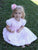 Baby girls white and pink heirloom dress with pink smocking