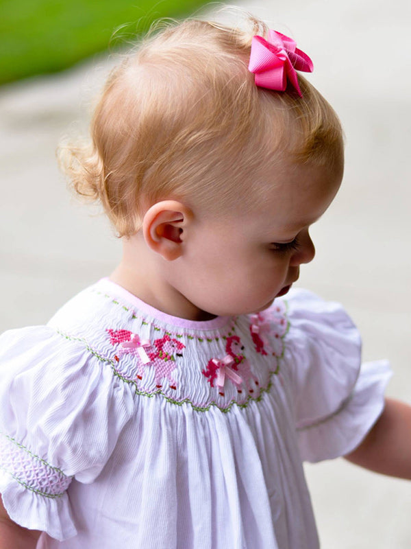 Girls dress with smocked pink horses