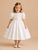 Baby girl in heirloom ivory silk dress with hand smocking and organza sash