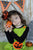 Girls green jack-o-lantern Halloween dress with orange and black accents