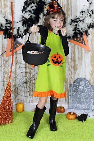 Girl wearing jack-o-lantern Halloween A-line dress for trick-or-treating