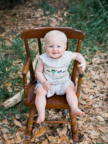 Baby boy wearing hand smocked Frankenstein Halloween shortall